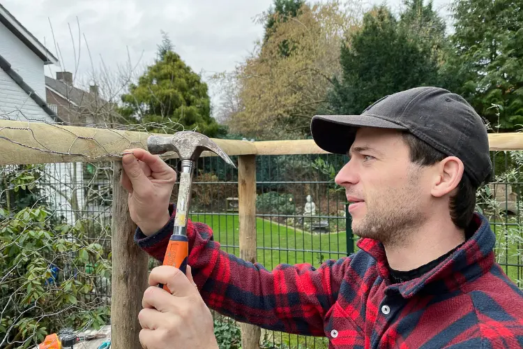 man building a chicken coop