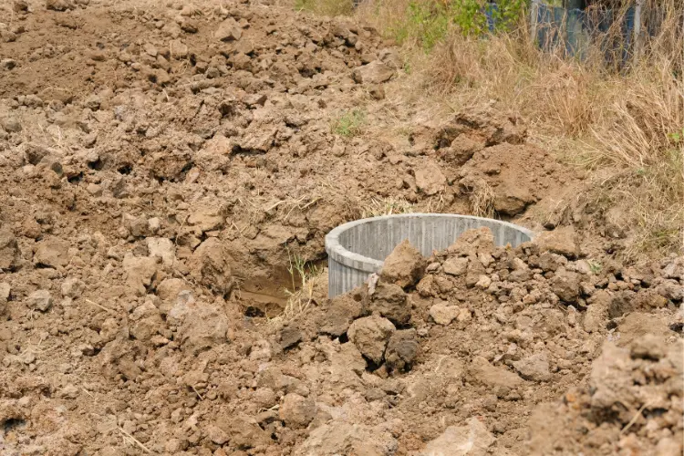 septic tank buried on ground at construction site